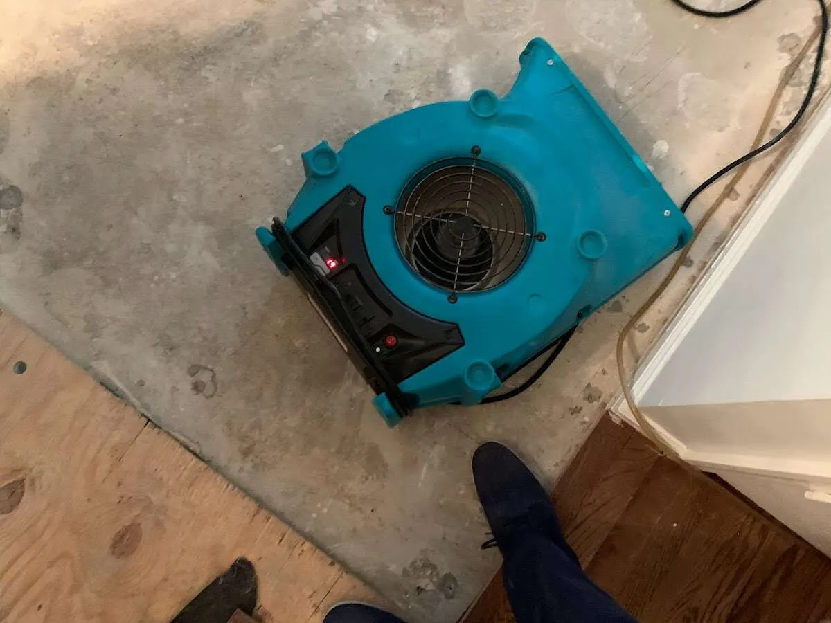 Air mover drying subfloor during Leak Detection & Repair in Bucyrus